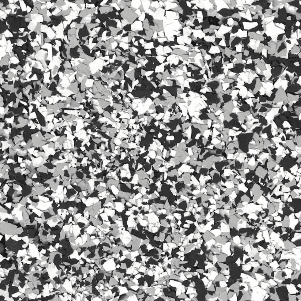 This image shows a black and white abstract pattern composed of various irregular shapes, resembling a mosaic or a camouflage texture.