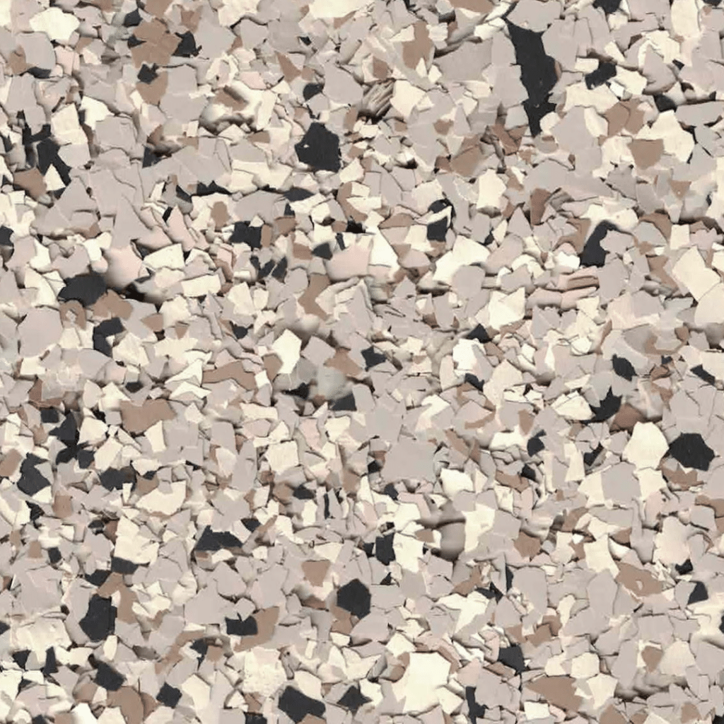 The image shows a close-up of a speckled surface with beige, white, brown, and black fragments creating a textured pattern.