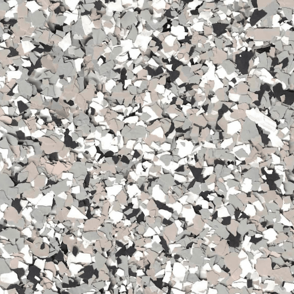 A close-up view of a speckled, multicolored surface featuring shades of gray, white, and black, resembling a terrazzo pattern or composite flooring.