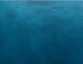 The image shows a calm, deep blue ocean without any visible landmarks, buildings, people, or animals. The water surface is slightly textured.