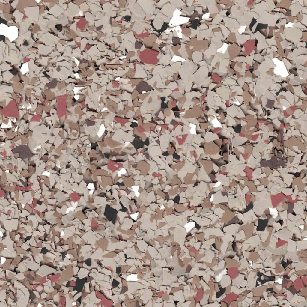 The image displays a close-up of a speckled surface with various shades of beige, brown, red, black, and white flakes interspersed throughout.