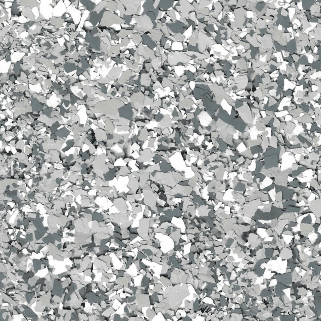 A close-up image of a textured surface with various shades of gray and white particles of different sizes, possibly gravel or decorative stone.